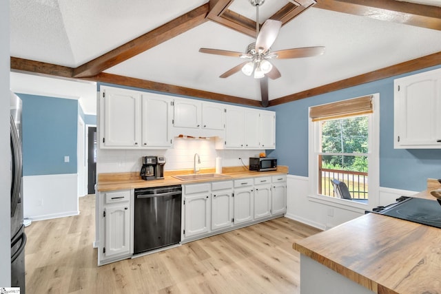 kitchen featuring vaulted ceiling with beams, white cabinetry, sink, and appliances with stainless steel finishes