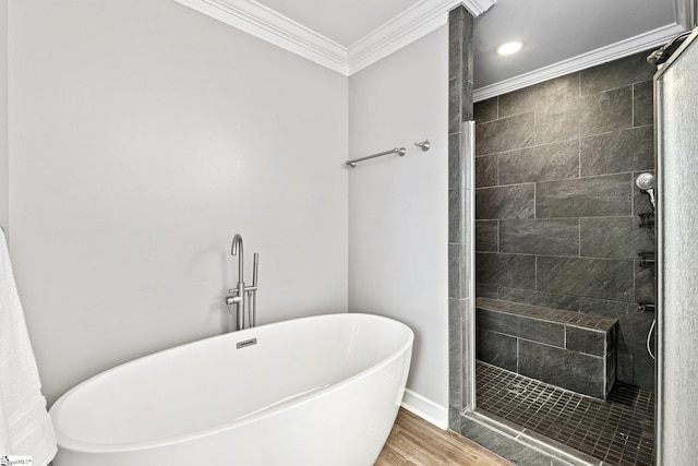 bathroom with independent shower and bath, crown molding, and wood-type flooring