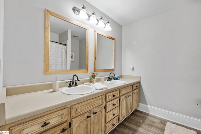 bathroom featuring hardwood / wood-style floors and vanity