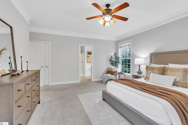 bedroom with ceiling fan, crown molding, ensuite bathroom, and light colored carpet