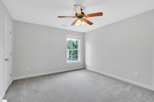 empty room featuring ceiling fan and carpet floors