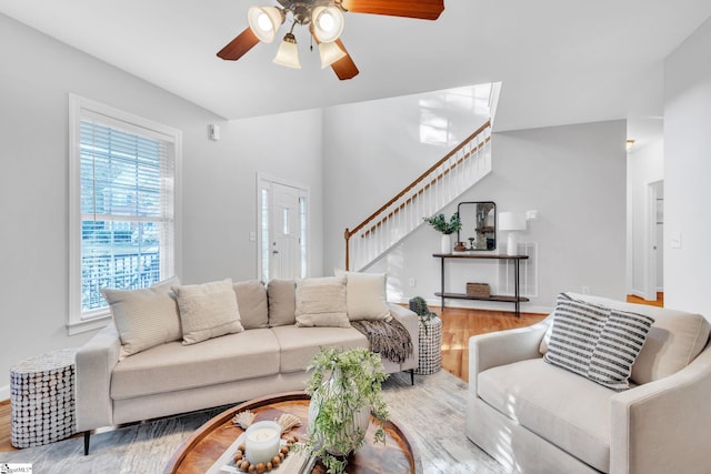 living room with hardwood / wood-style floors and ceiling fan