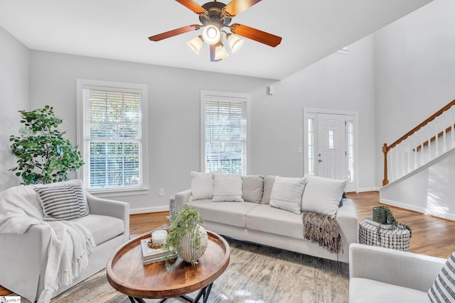 living room with hardwood / wood-style flooring and ceiling fan