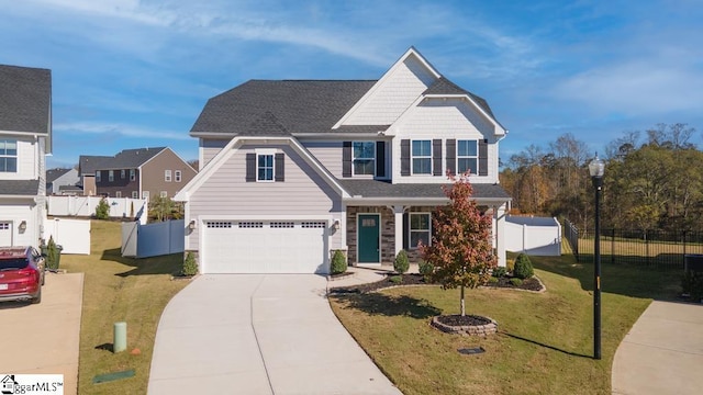 craftsman-style home with a garage and a front lawn