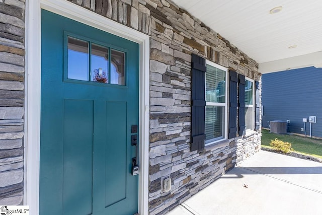 entrance to property with central AC unit