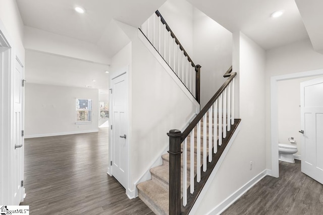 stairway featuring hardwood / wood-style floors