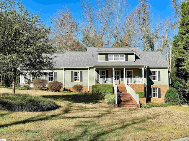 front of property featuring a front lawn and a porch