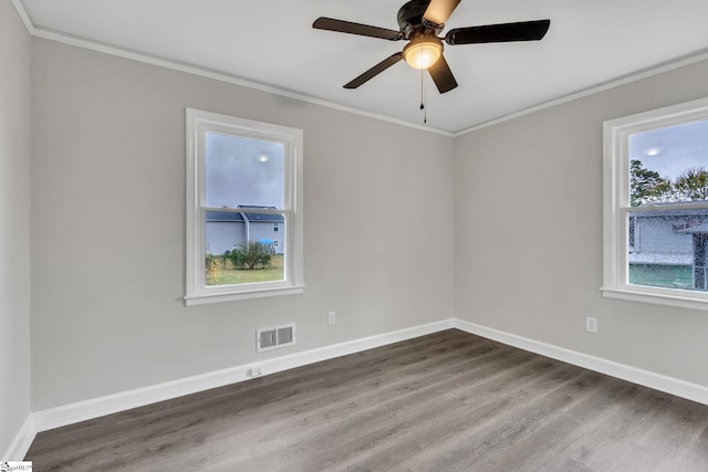 unfurnished room with crown molding, hardwood / wood-style floors, and ceiling fan