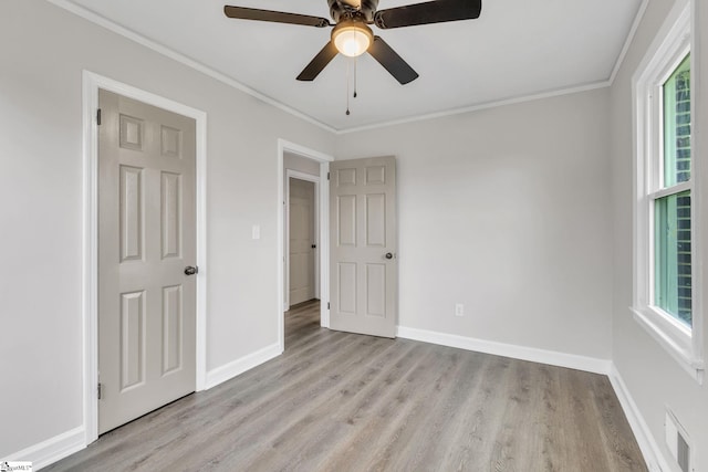 unfurnished bedroom featuring ceiling fan, light hardwood / wood-style flooring, and ornamental molding