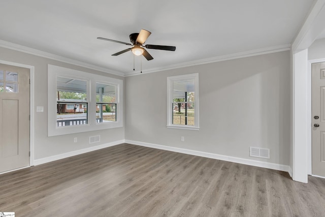 entryway with ceiling fan, ornamental molding, and light hardwood / wood-style flooring