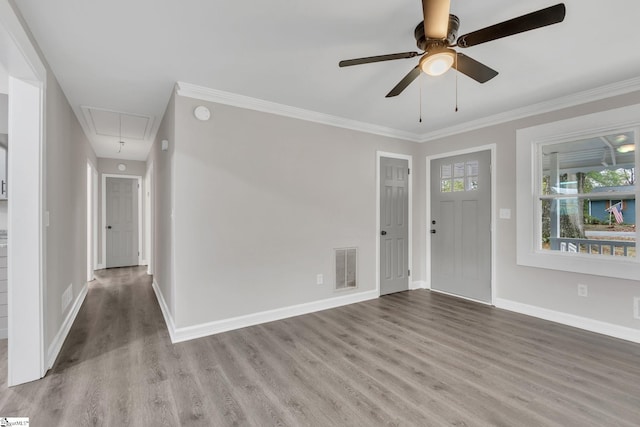 spare room featuring crown molding, ceiling fan, and light wood-type flooring