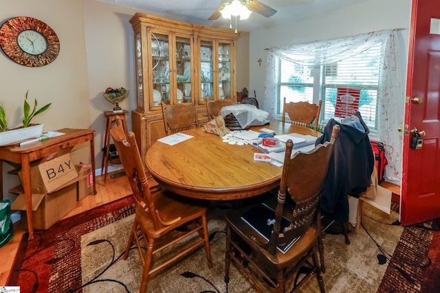 dining room with hardwood / wood-style flooring and ceiling fan