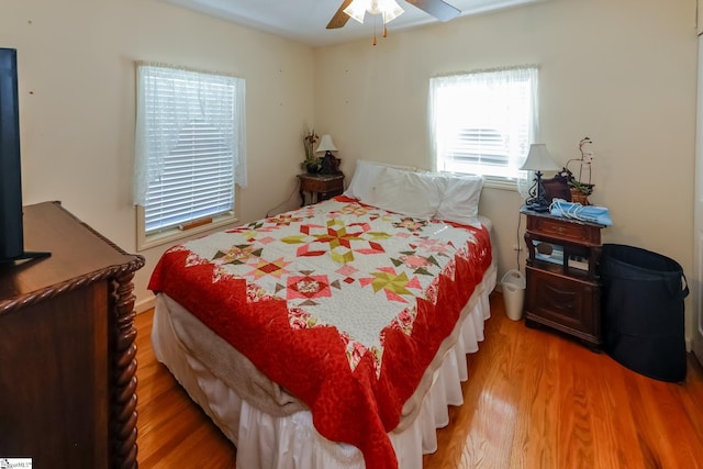 bedroom featuring ceiling fan and hardwood / wood-style floors