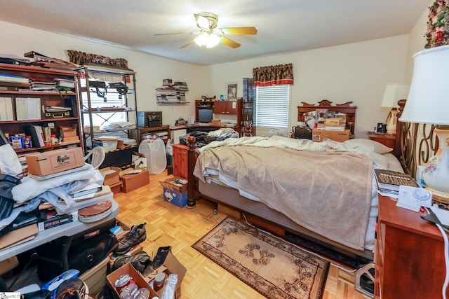 bedroom with ceiling fan and light parquet flooring