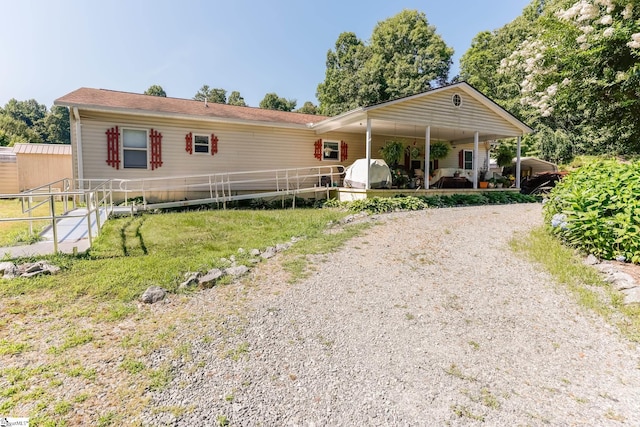 view of front of property featuring covered porch