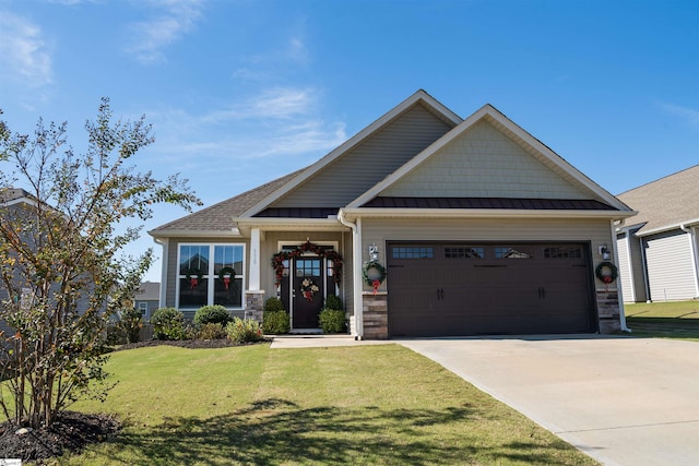 craftsman-style home featuring a garage and a front lawn