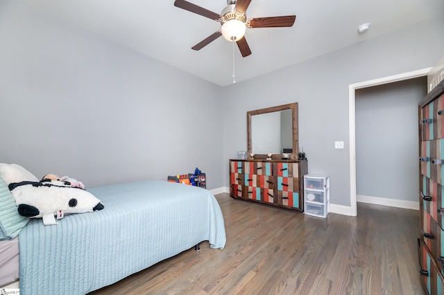 bedroom with ceiling fan and dark hardwood / wood-style floors