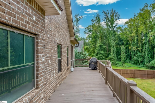 wooden deck with grilling area