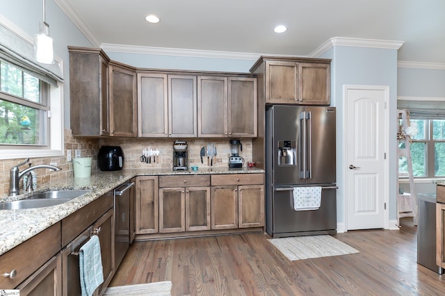 kitchen featuring backsplash, dark hardwood / wood-style floors, sink, and appliances with stainless steel finishes