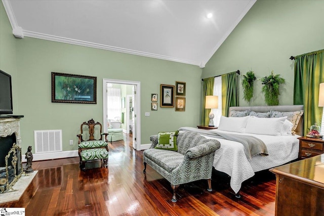 bedroom with crown molding, dark wood-type flooring, and high vaulted ceiling