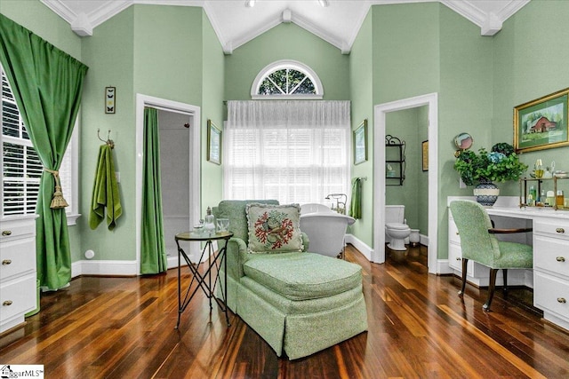 sitting room with dark hardwood / wood-style flooring, high vaulted ceiling, built in desk, and ornamental molding