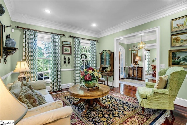 living room with hardwood / wood-style floors and ornamental molding