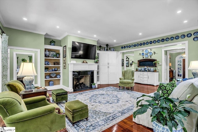 living room with hardwood / wood-style floors and ornamental molding