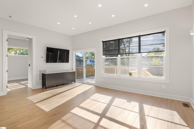 unfurnished living room with light hardwood / wood-style flooring