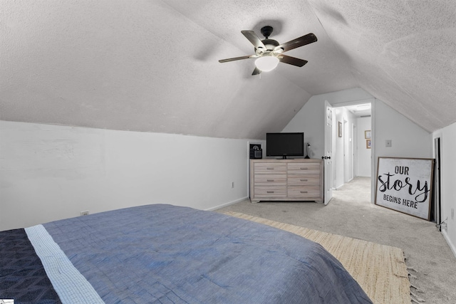 bedroom featuring lofted ceiling, ceiling fan, light carpet, and a textured ceiling