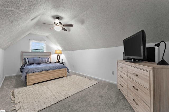 bedroom featuring ceiling fan, dark carpet, a textured ceiling, and vaulted ceiling