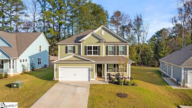 craftsman house featuring central AC unit, a garage, and a front yard