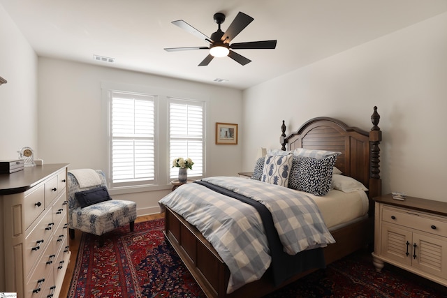 bedroom featuring dark hardwood / wood-style flooring and ceiling fan