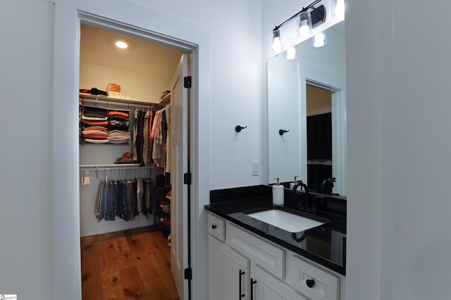 bathroom with vanity and wood-type flooring