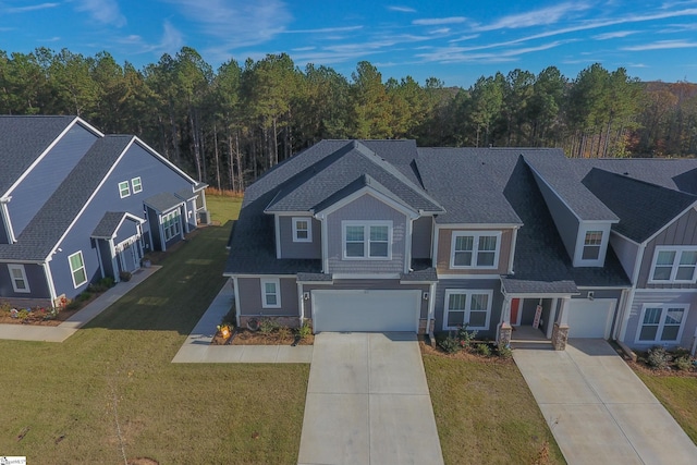 view of front facade featuring a garage and a front lawn