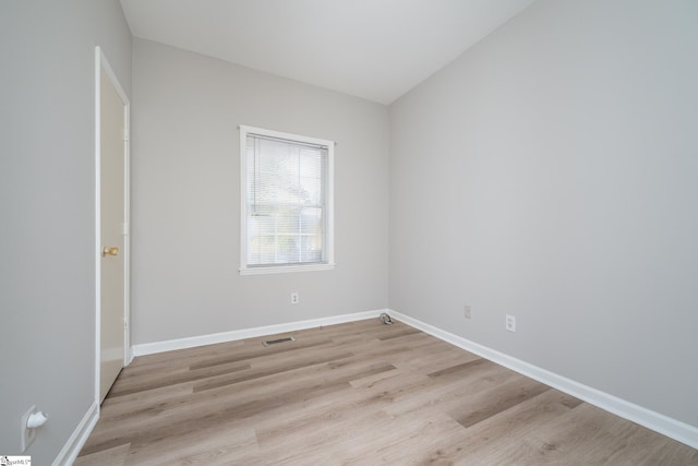 spare room with light hardwood / wood-style floors