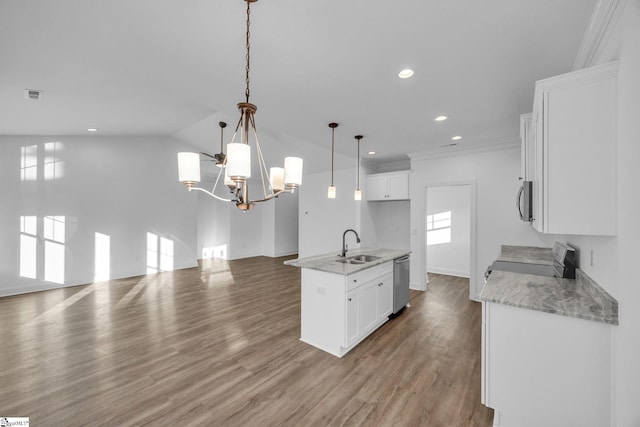 kitchen featuring white cabinetry, sink, hanging light fixtures, stainless steel appliances, and light hardwood / wood-style floors