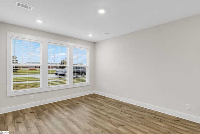 spare room featuring light hardwood / wood-style flooring