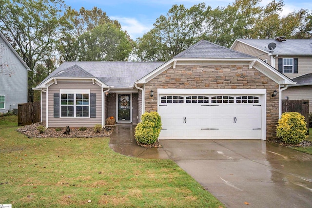 view of front of property with a garage and a front lawn