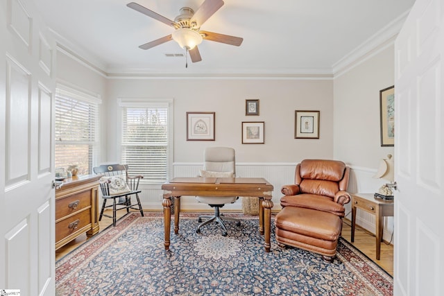 office area with hardwood / wood-style flooring, ceiling fan, and ornamental molding