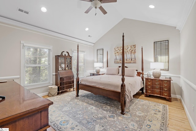 bedroom featuring ceiling fan, light wood-type flooring, lofted ceiling, and crown molding