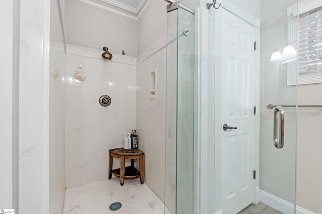 bathroom featuring an enclosed shower and ornamental molding