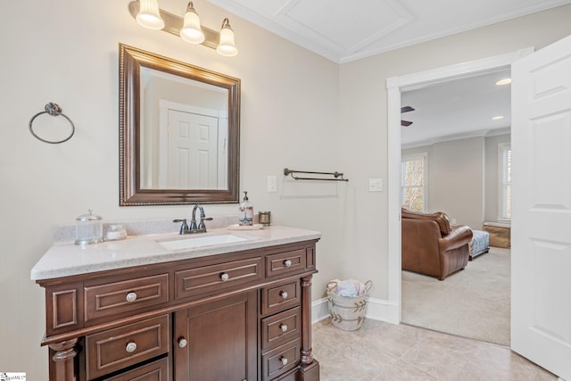 bathroom with tile patterned flooring, vanity, and crown molding