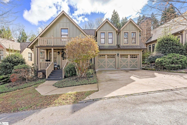 view of front of house featuring covered porch and a garage