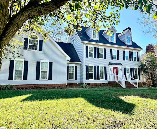 colonial house featuring a front yard