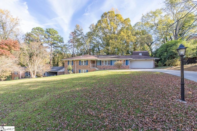 ranch-style home with a front lawn and a garage