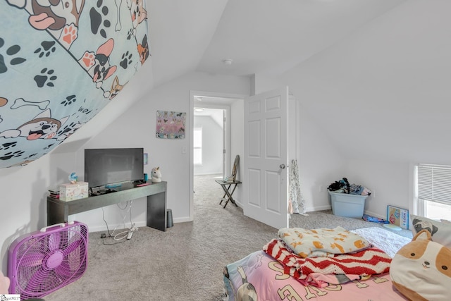 bedroom with carpet flooring, lofted ceiling, and multiple windows