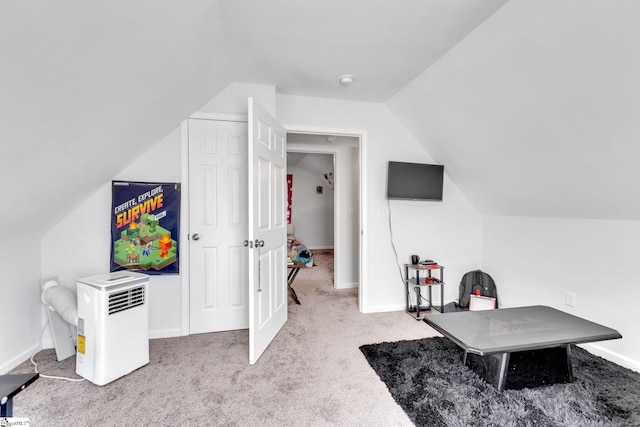 carpeted office with vaulted ceiling