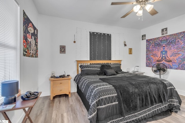 bedroom featuring ceiling fan and wood-type flooring