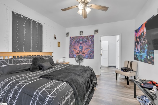 bedroom with hardwood / wood-style flooring and ceiling fan