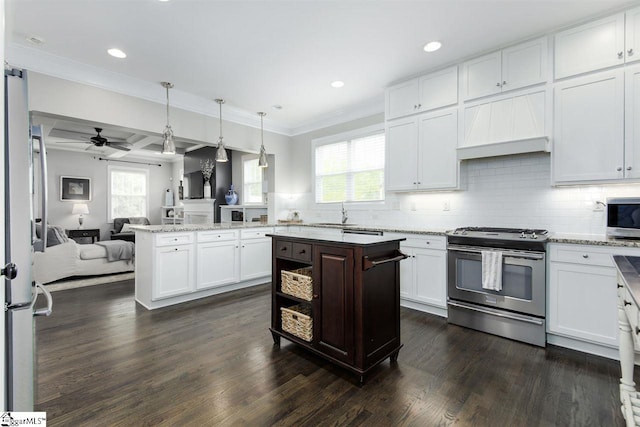 kitchen with pendant lighting, dark hardwood / wood-style flooring, stainless steel appliances, and a wealth of natural light